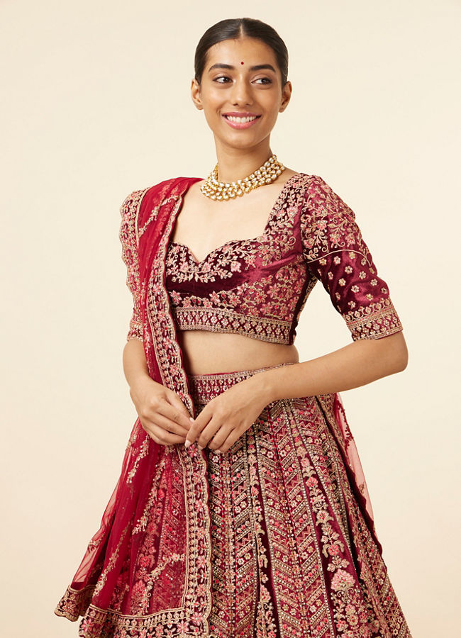 alt message - Mohey Women Maroon Embellished Bridal Lehenga image number 1